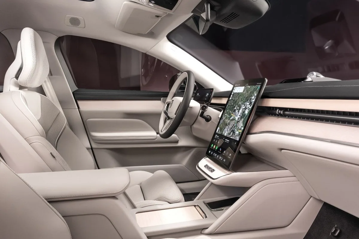 Volvo ES90 front cabin showing the central touchscreen and light interior