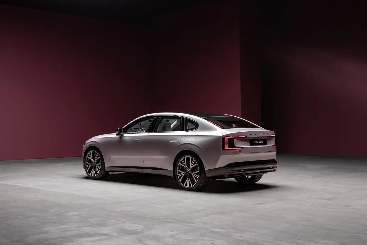 Volvo ES90 rear three-quarter view in a studio setting