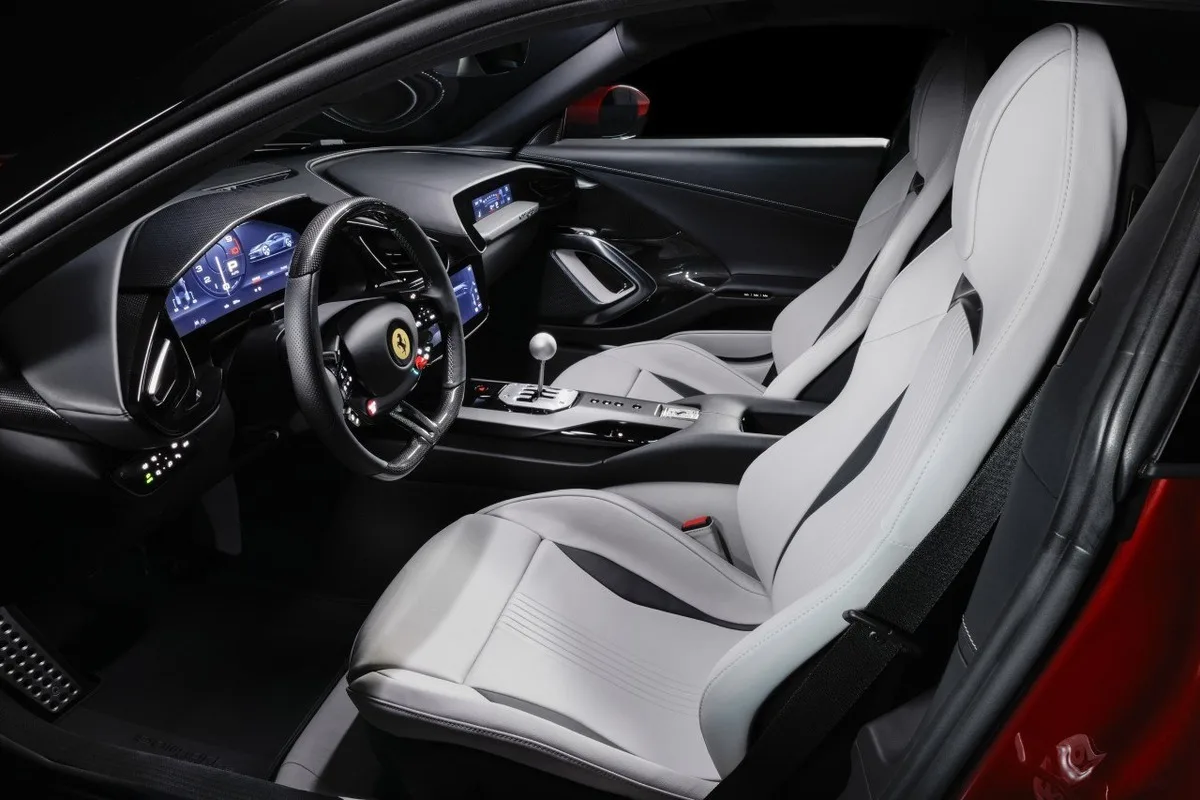 Ferrari 12Cilindri Manuale cabin showing light leather seats and the manual-style centre console