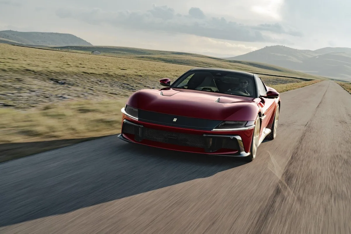 Ferrari 12Cilindri Manuale driving on an open mountain road