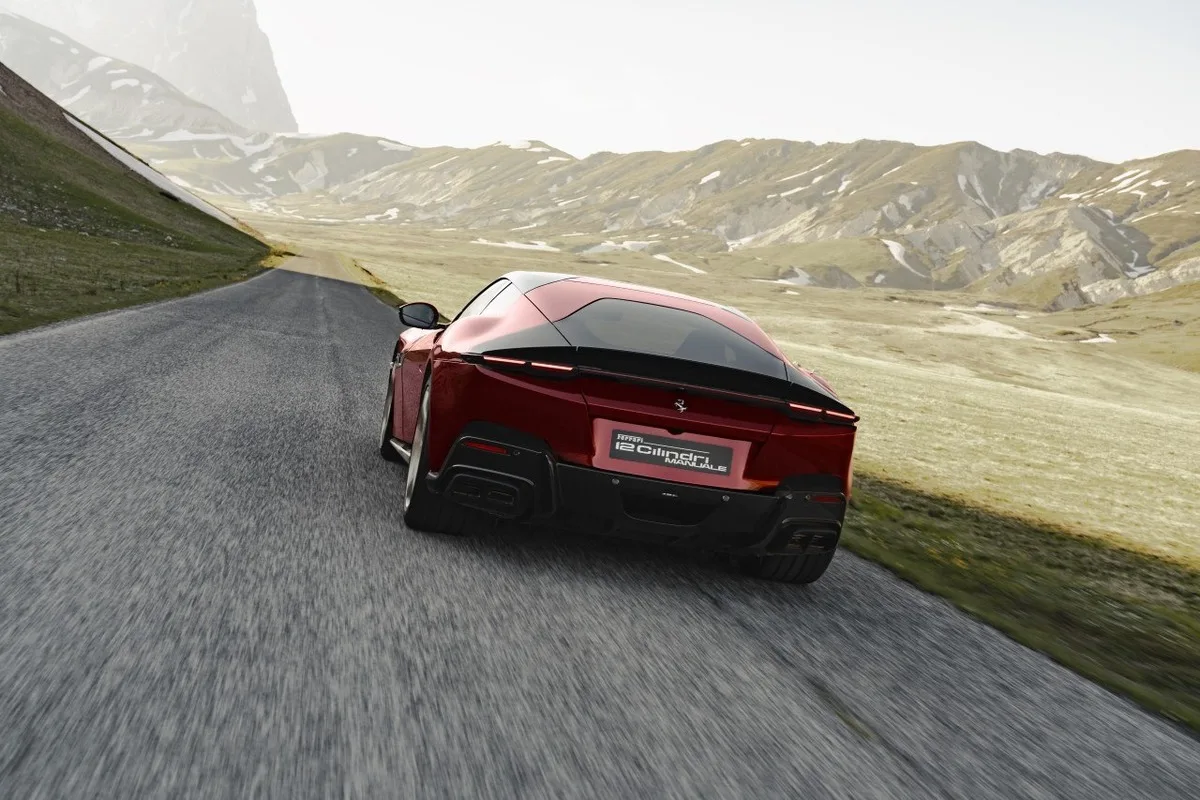 Ferrari 12Cilindri Manuale seen from the rear while driving through mountain scenery