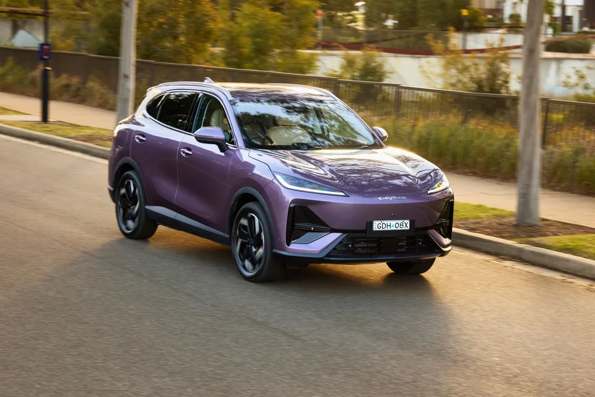 Purple Lepas L6 EV driving in a suburban street