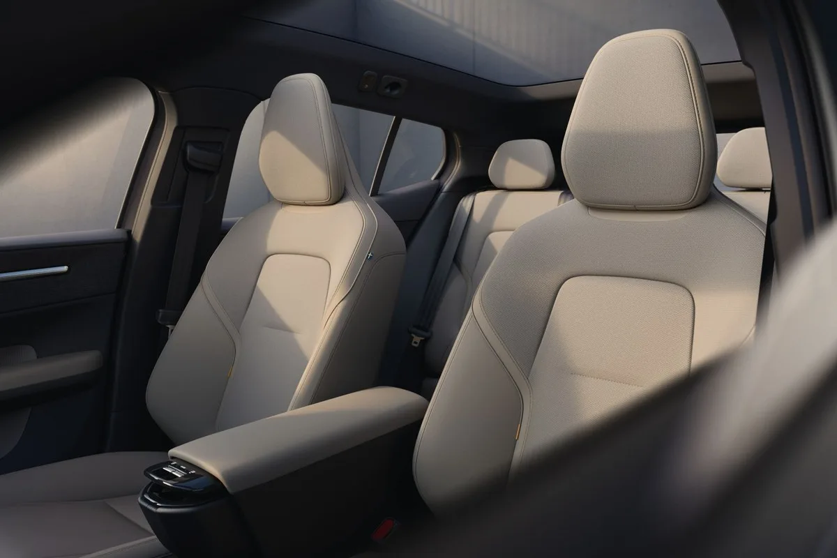 Cream fabric front seats of the Volvo EX30 seen from the side