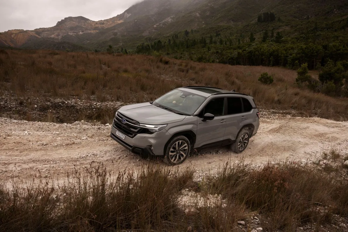 Grey Subaru Forester Hybrid on a gravel mountain track