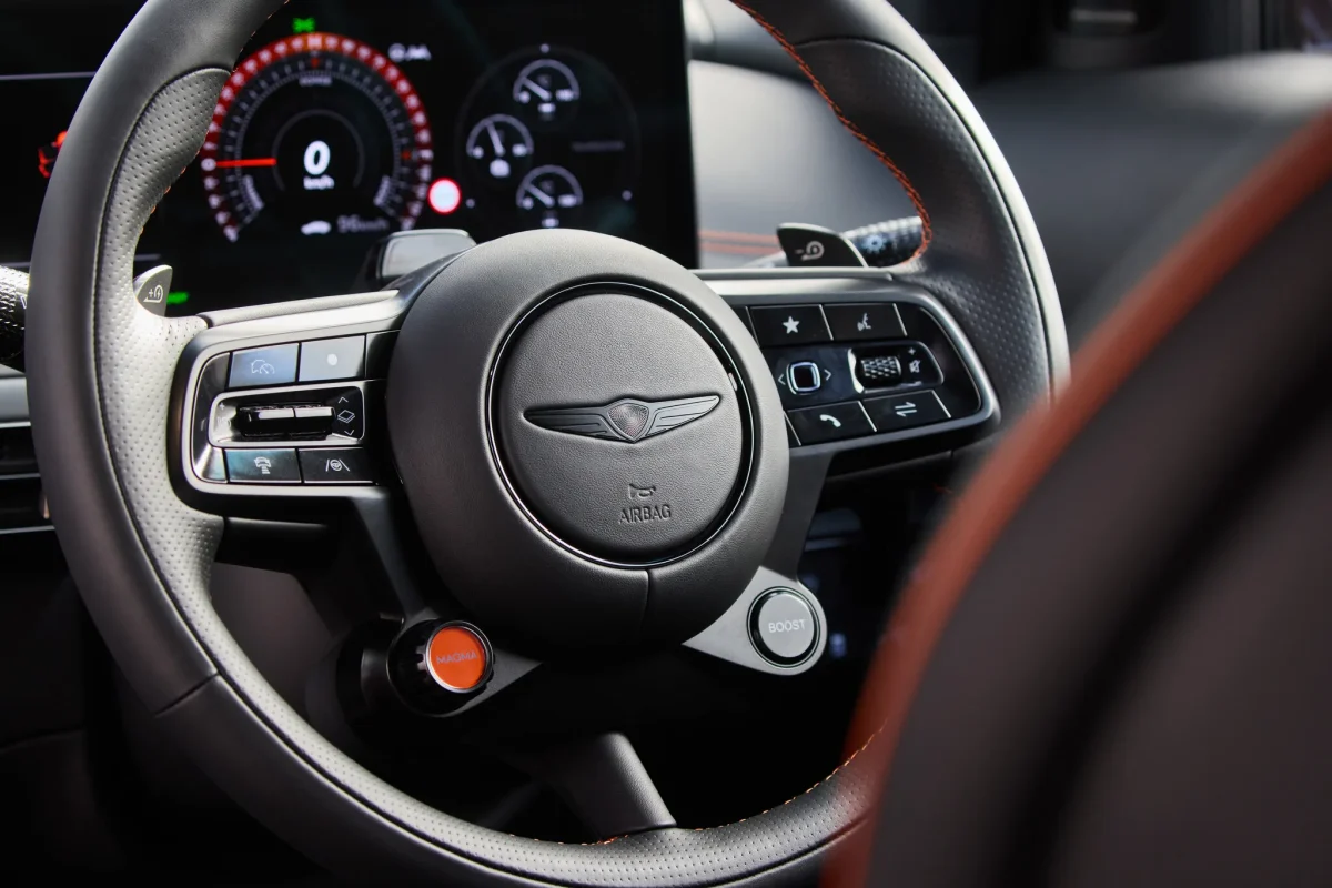 Genesis GV60 Magma steering wheel with Genesis emblem and drive controls