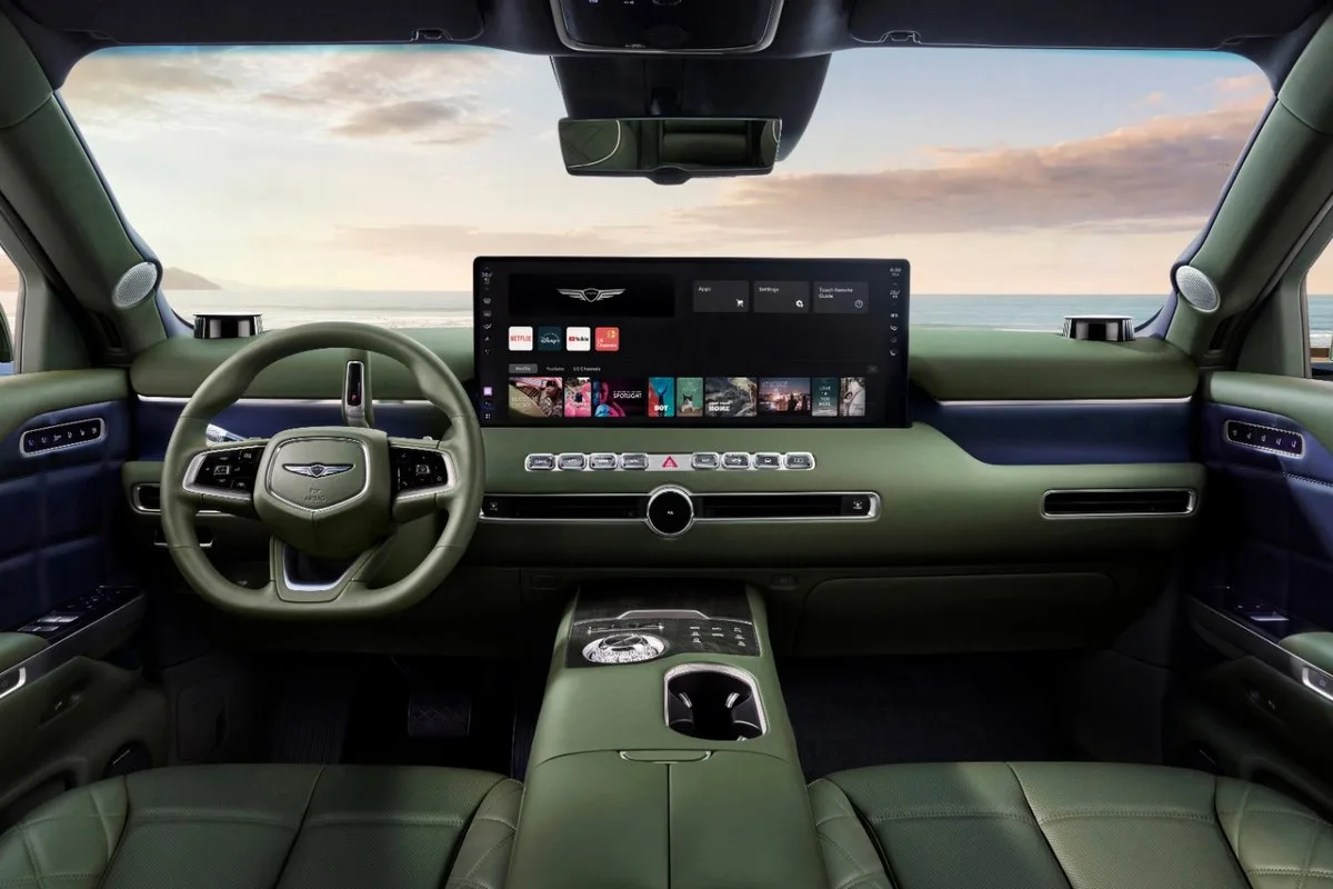 Genesis GV90 dashboard in green and navy leather with the centre display showing apps