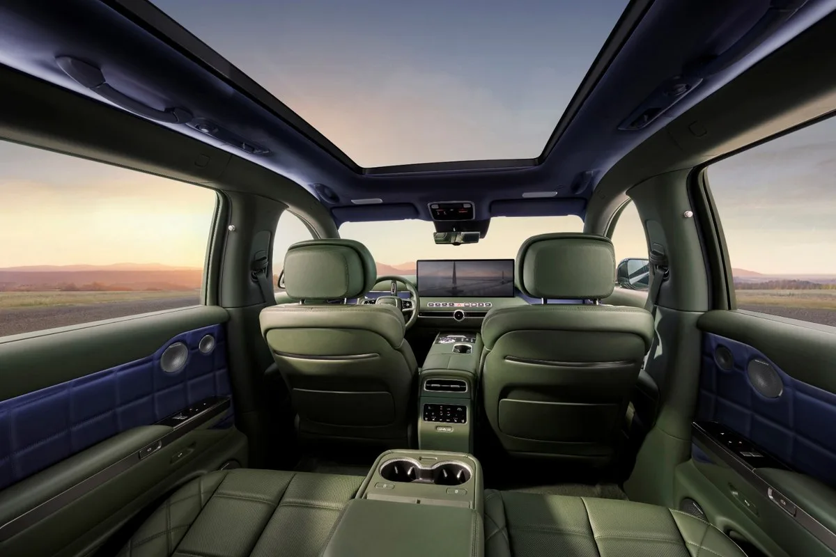 Genesis GV90 cabin looking forward from the third row, green leather and glass roof