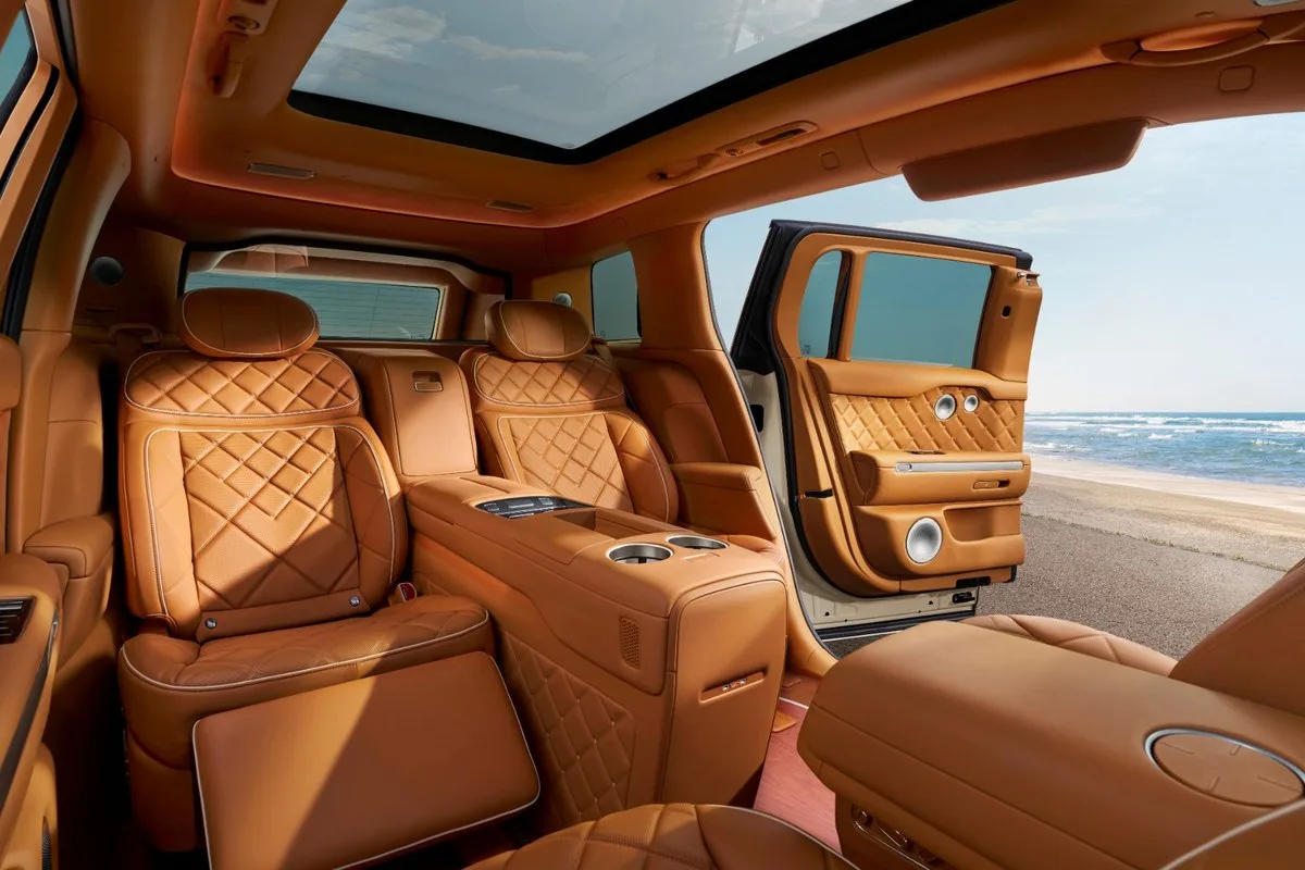 Tan leather rear seats and centre console in the Genesis GV90 Neolun Executive Suite