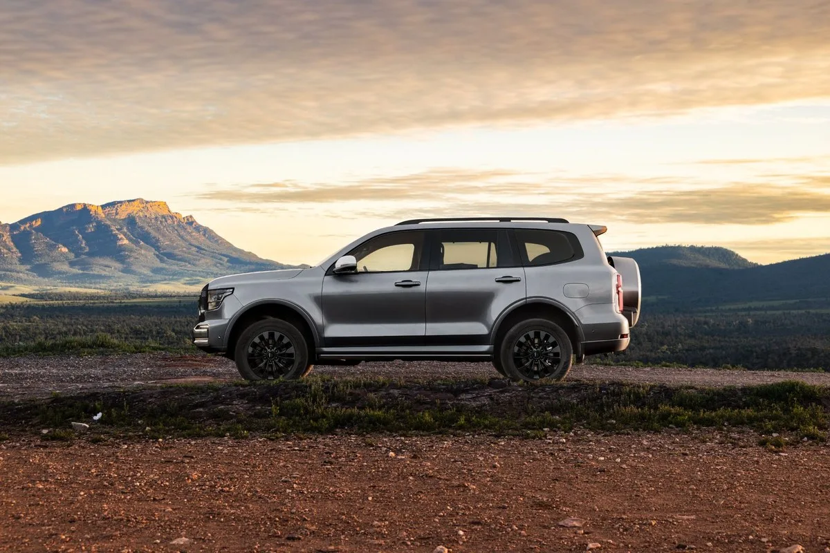 Silver GWM Tank 500 parked side-on with mountain ranges behind