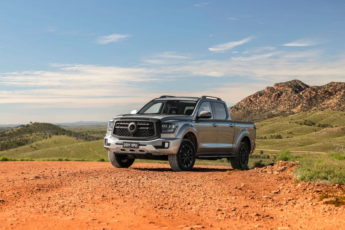 GWM Cannon Alpha dual-cab ute parked on a gravel lookout