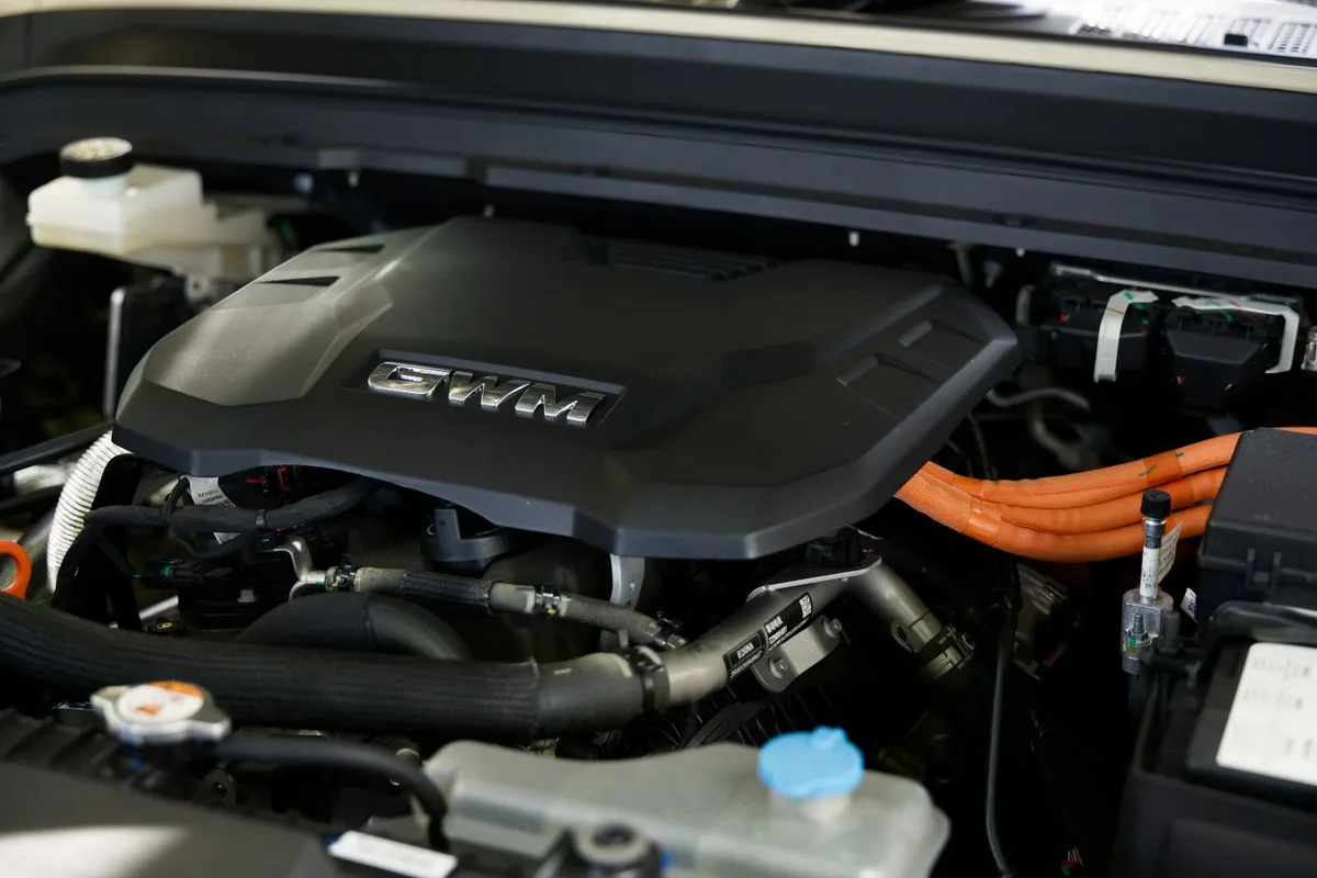 GWM Tank 300 Ultra Hi4-T engine bay showing the covered 2.0-litre turbo and orange high-voltage cables