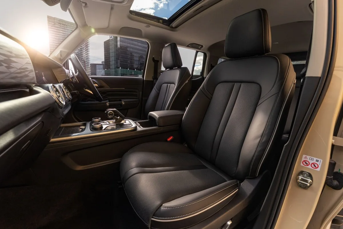 GWM Tank 300 Ultra Hi4-T front seats with a city skyline through the glass roof