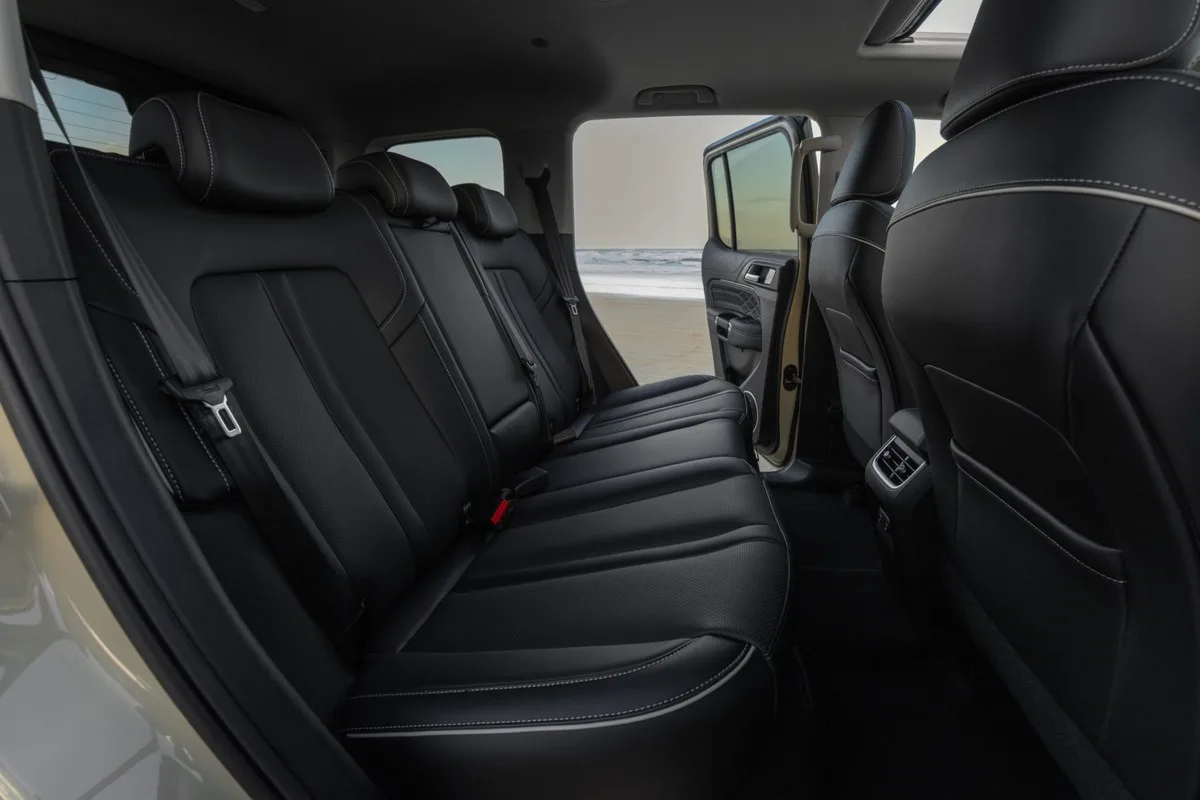 GWM Tank 300 Ultra Hi4-T rear seats with a beach through the open door
