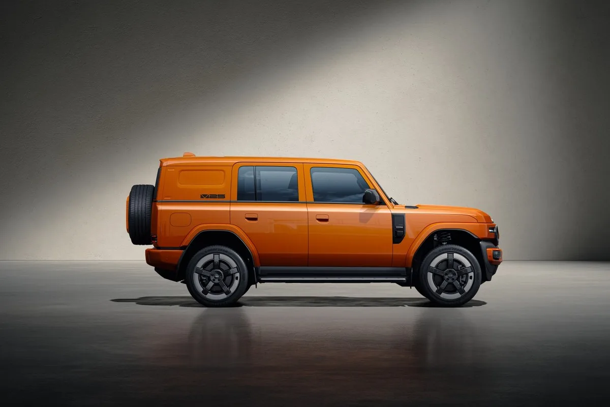 Orange iCAUR V25 in side profile with the spare wheel on the tailgate