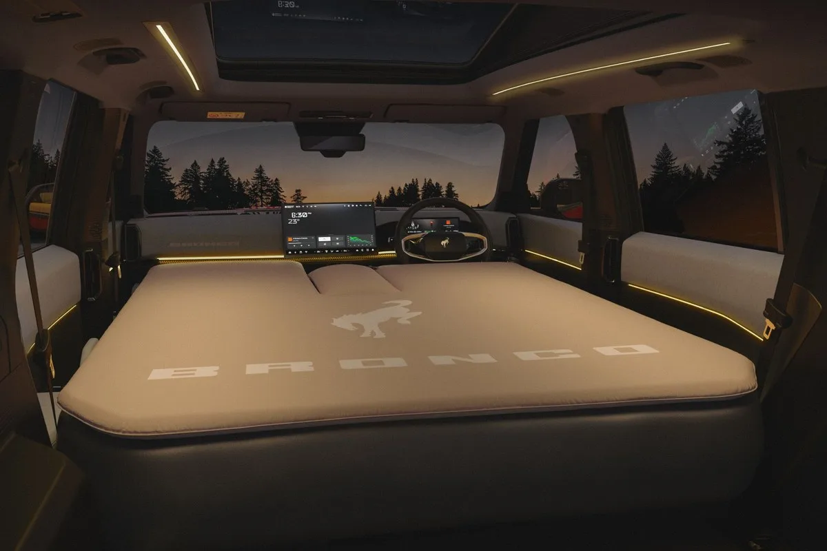 Ford Bronco Basecamp interior at night with the full-length mattress in place