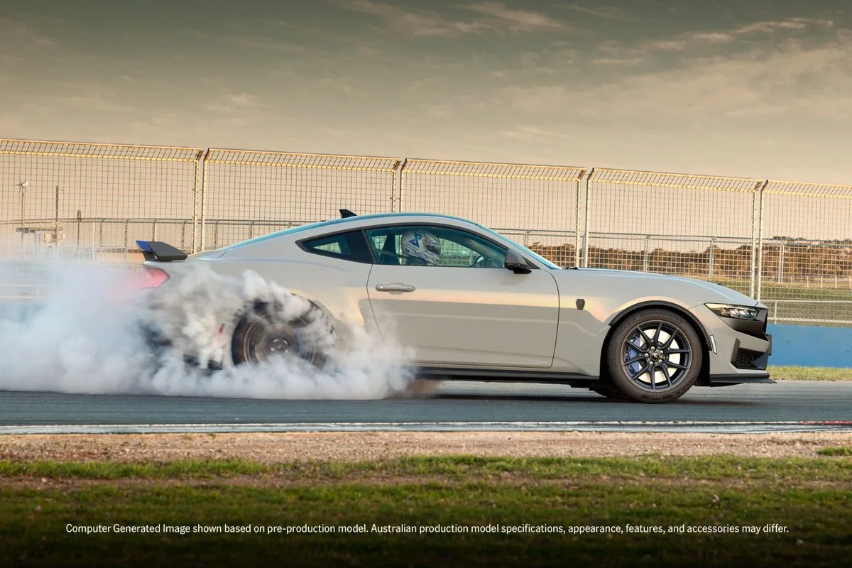 Ford Mustang Dark Horse T8-Spec pack in profile with the rear tyres smoking