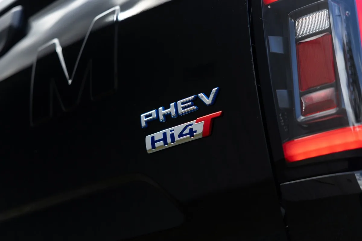 PHEV Hi4-T badge on the tailgate of a black GWM Cannon ute