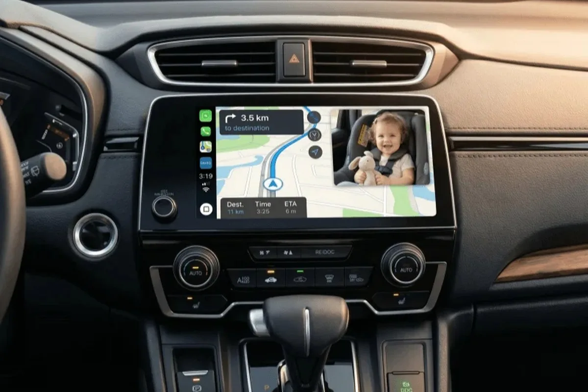 CarPlay navigation screen with a live back-seat baby camera window in the corner