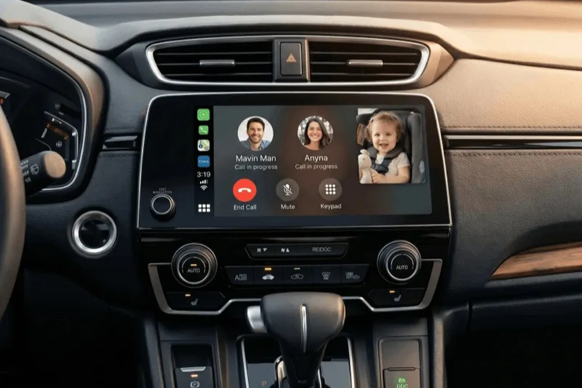 CarPlay phone call screen with a live back-seat baby camera window