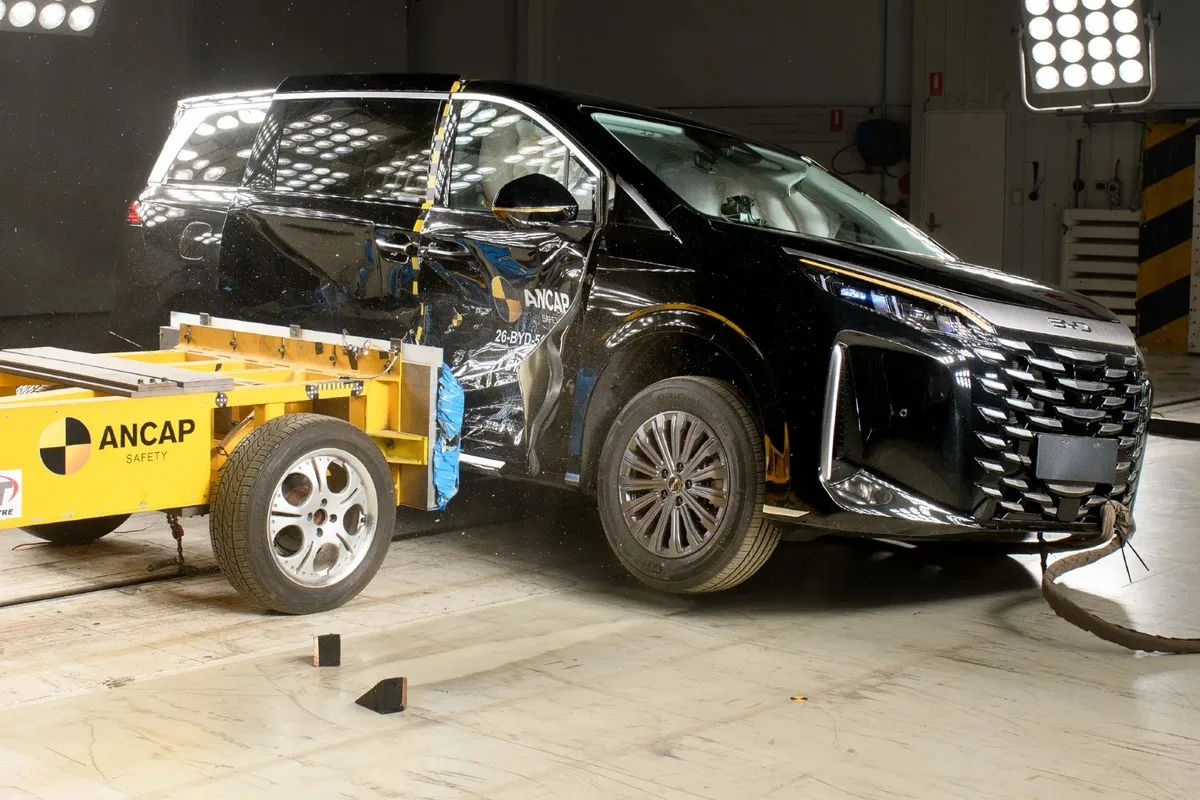 Black BYD M9 after the ANCAP side impact test with the yellow barrier