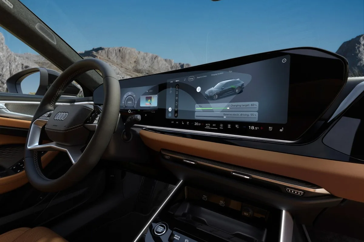 Audi A6 allroad e-hybrid charging screen and brown leather dash