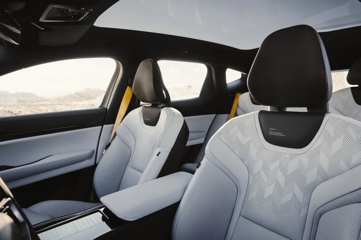 2027 Polestar 3 light grey front seats with yellow seatbelts under the glass roof