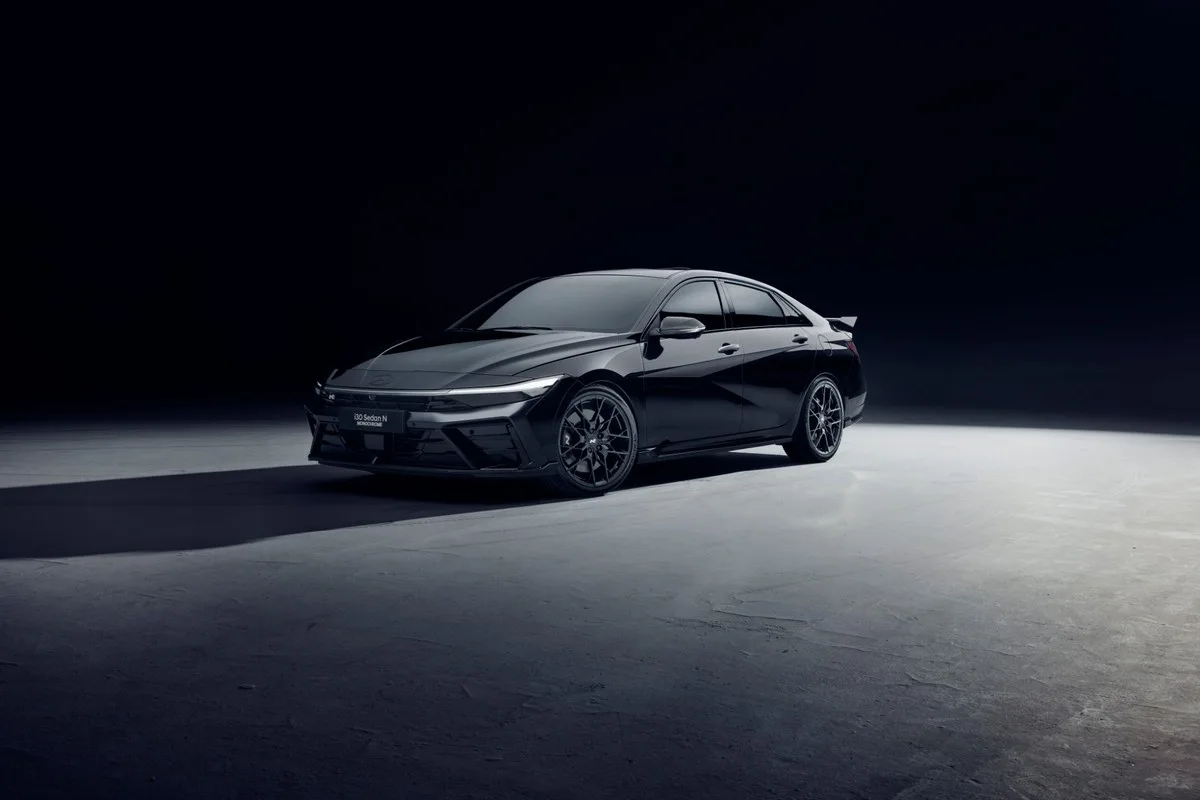 Black Hyundai i30 Sedan N Monochrome front three-quarter view