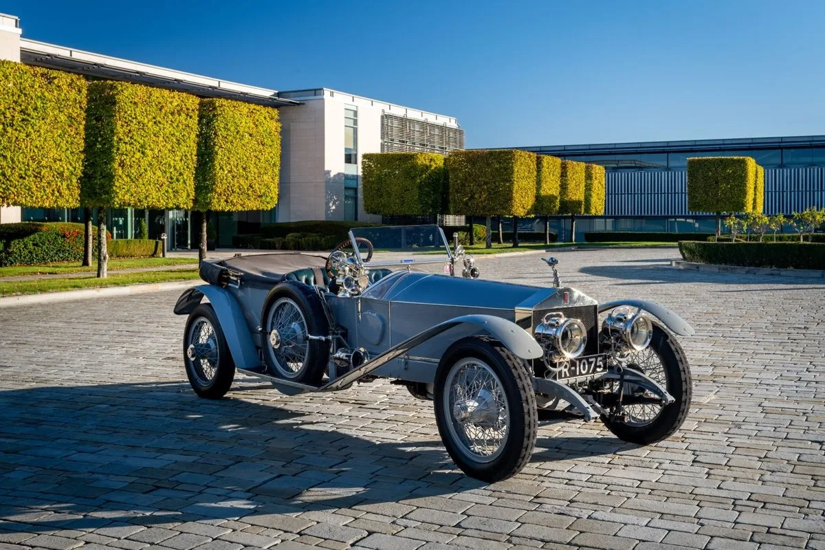 Silver Rolls-Royce Silver Ghost open tourer, front three-quarter view on a cobbled forecourt