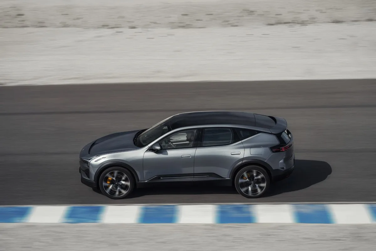 Grey 2027 Polestar 3 on a race track, seen side-on from above