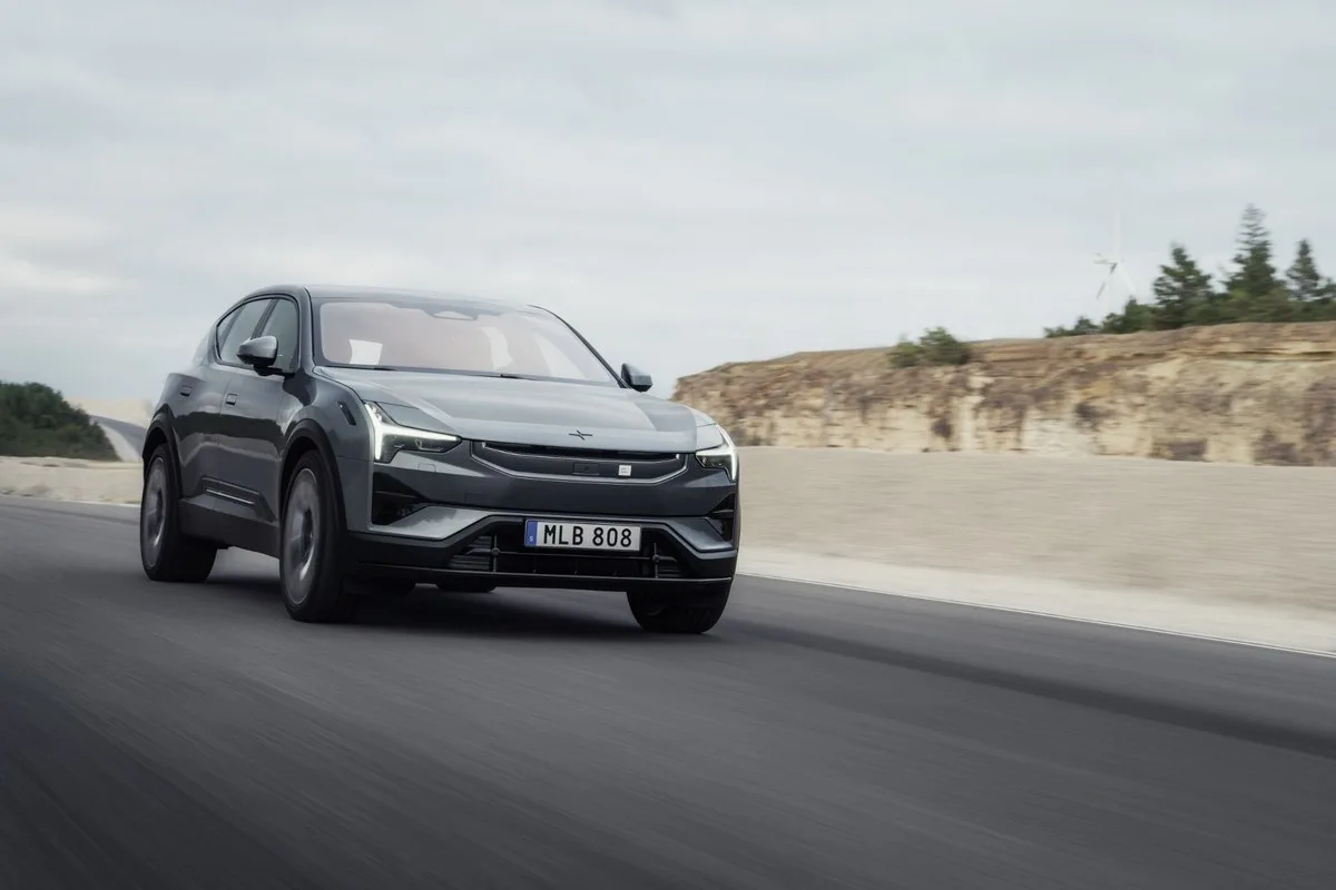 Grey 2027 Polestar 3 driving, front three-quarter view