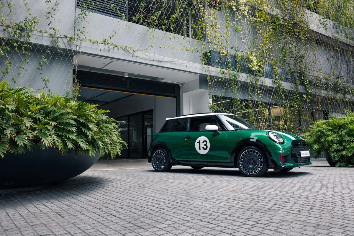 MINI Lucky 13 Edition in British Racing Green parked outside a vine-covered building