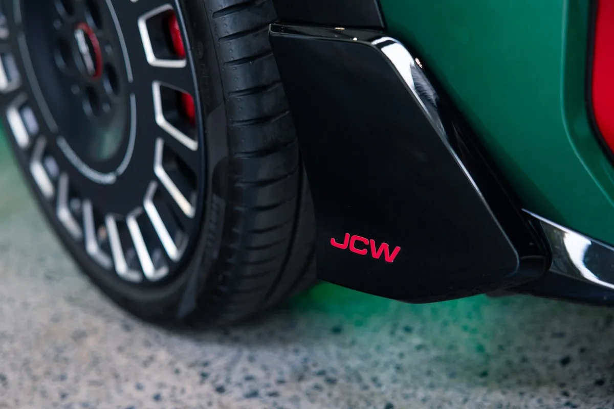Gloss black JCW front winglet beside the wheel of the MINI Lucky 13 Edition