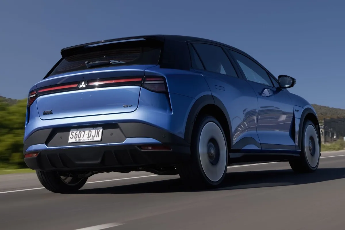 Blue Mitsubishi ASX VR-e from the rear driving on a country road