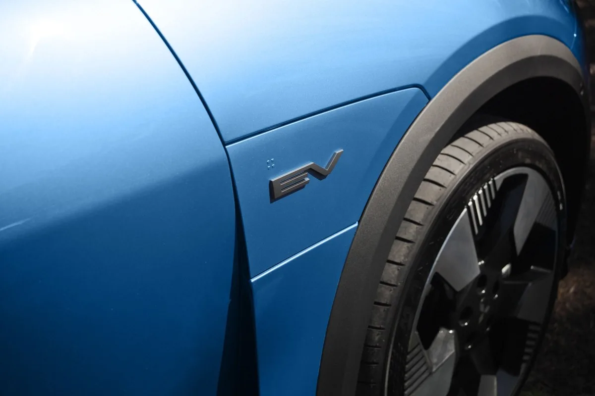 EV badge on the front guard of a blue Mitsubishi ASX VR-e