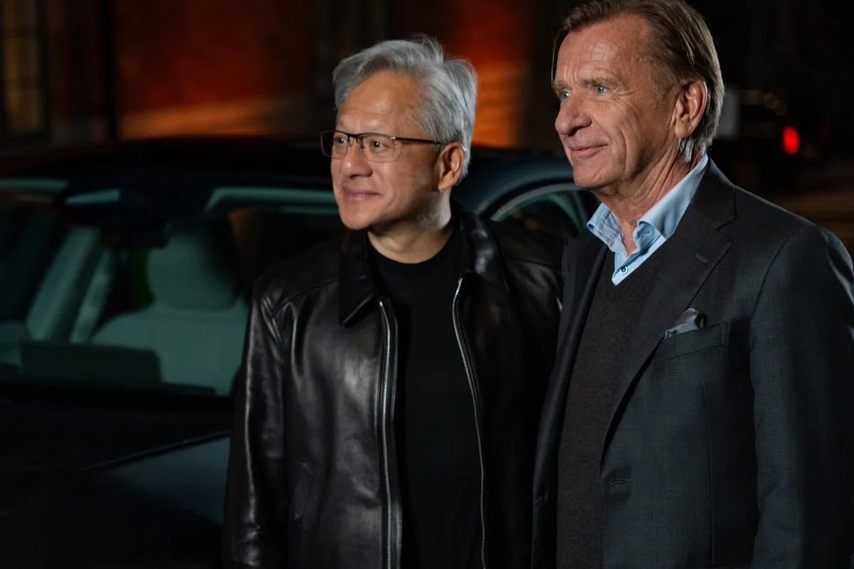 NVIDIA CEO Jensen Huang and Volvo Cars CEO Håkan Samuelsson side by side at night